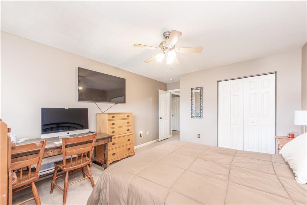 409 Commodore Drive McDonald, PA 15057 - Photo 32 of 49 a bedroom with a bed and a flat screen tv