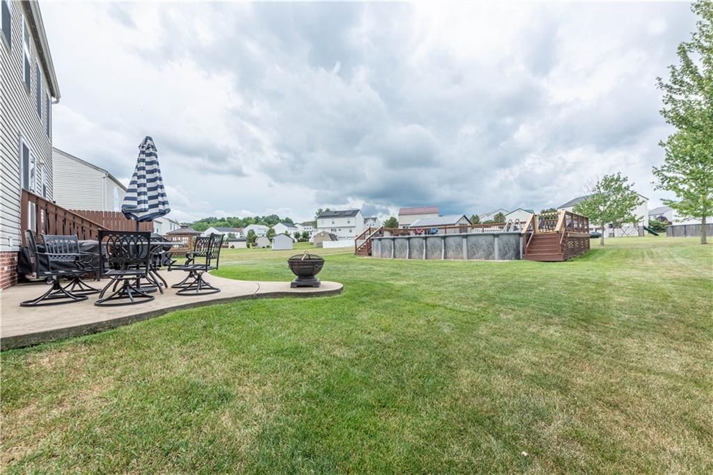 409 Commodore Drive McDonald, PA 15057 - Photo 41 of 49 a view of yard with outdoor seating and barbeque oven