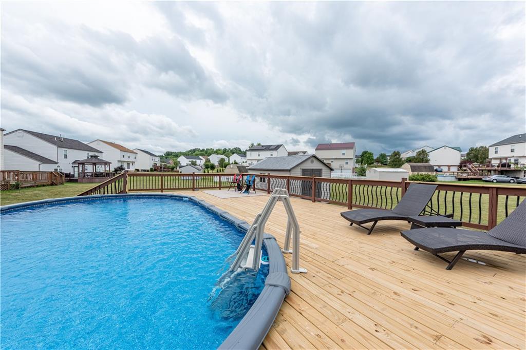 409 Commodore Drive McDonald, PA 15057 - Photo 43 of 49 a view of a swimming pool with a lounge chair