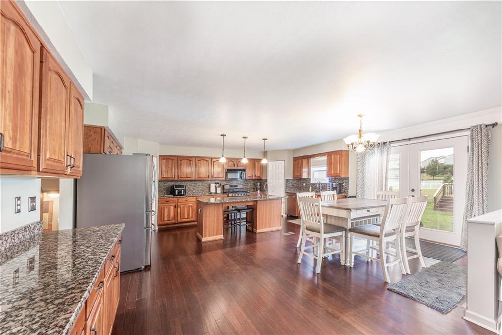 409 Commodore Drive McDonald, PA 15057 - Photo 10 of 49 a view of a dining room with furniture window and wooden floor