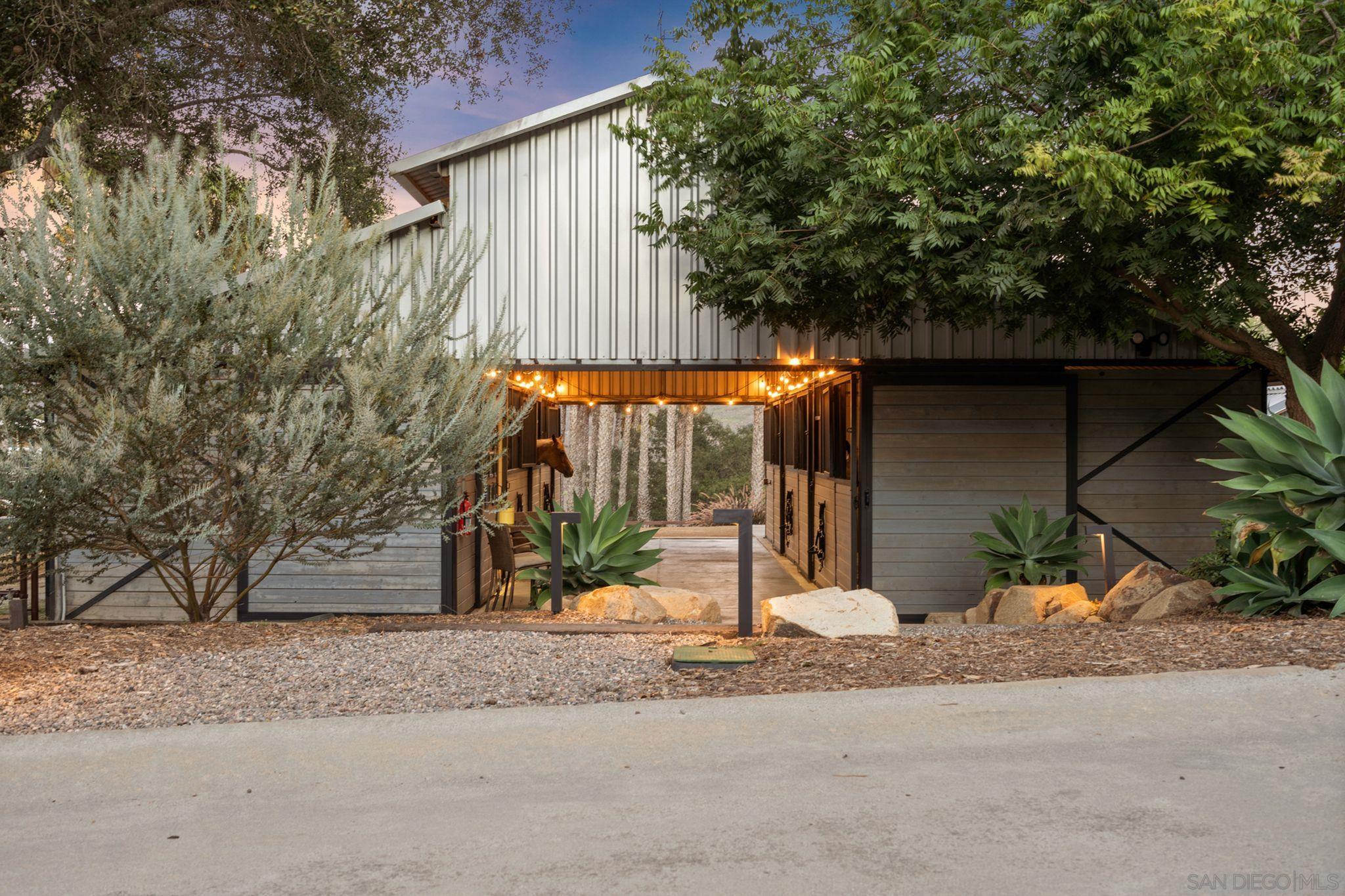 a view of a house with a tree beside it
