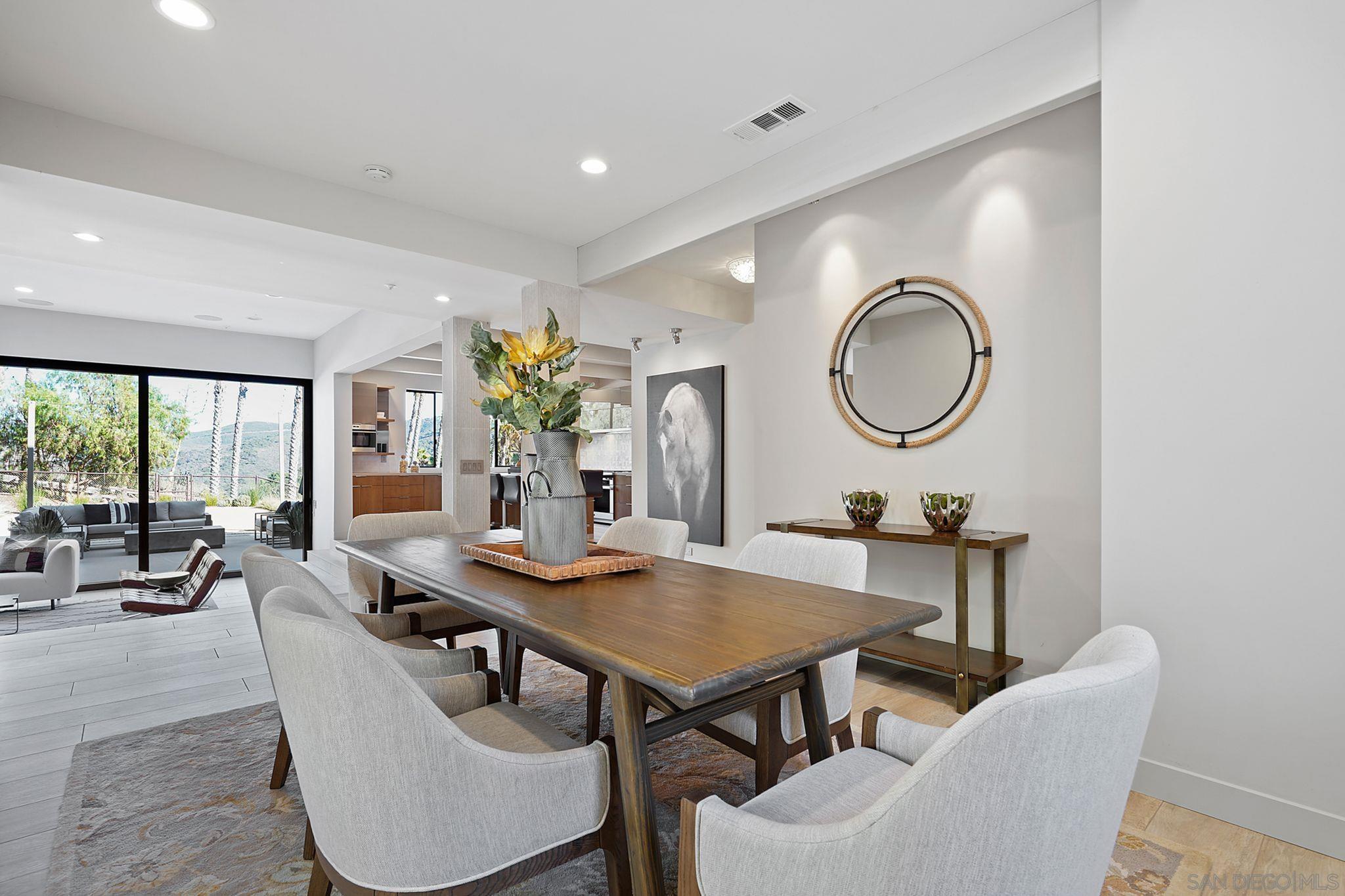 19969 Elfin Forest Lane Escondido, CA 92029 - Photo 15 of 53 a view of a dining room with furniture and a large window