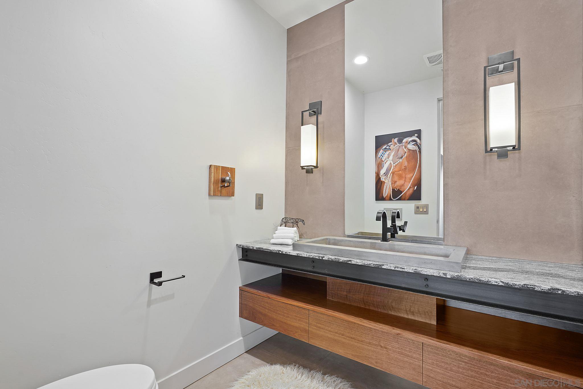 19969 Elfin Forest Lane Escondido, CA 92029 - Photo 16 of 53 a en suite bathroom with a granite countertop sink and a mirror
