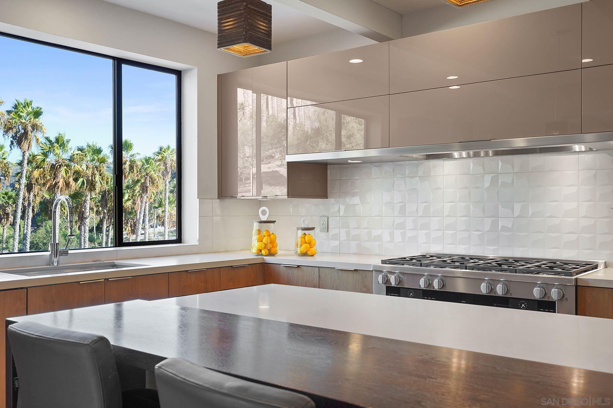 19969 Elfin Forest Lane Escondido, CA 92029 - Photo 18 of 53 a kitchen with stainless steel appliances a sink a stove and a window