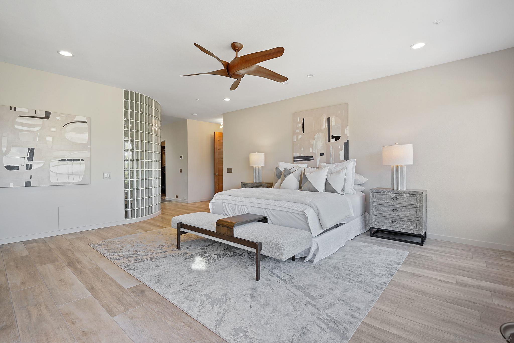 19969 Elfin Forest Lane Escondido, CA 92029 - Photo 26 of 53 a bedroom with a bed and a chandelier