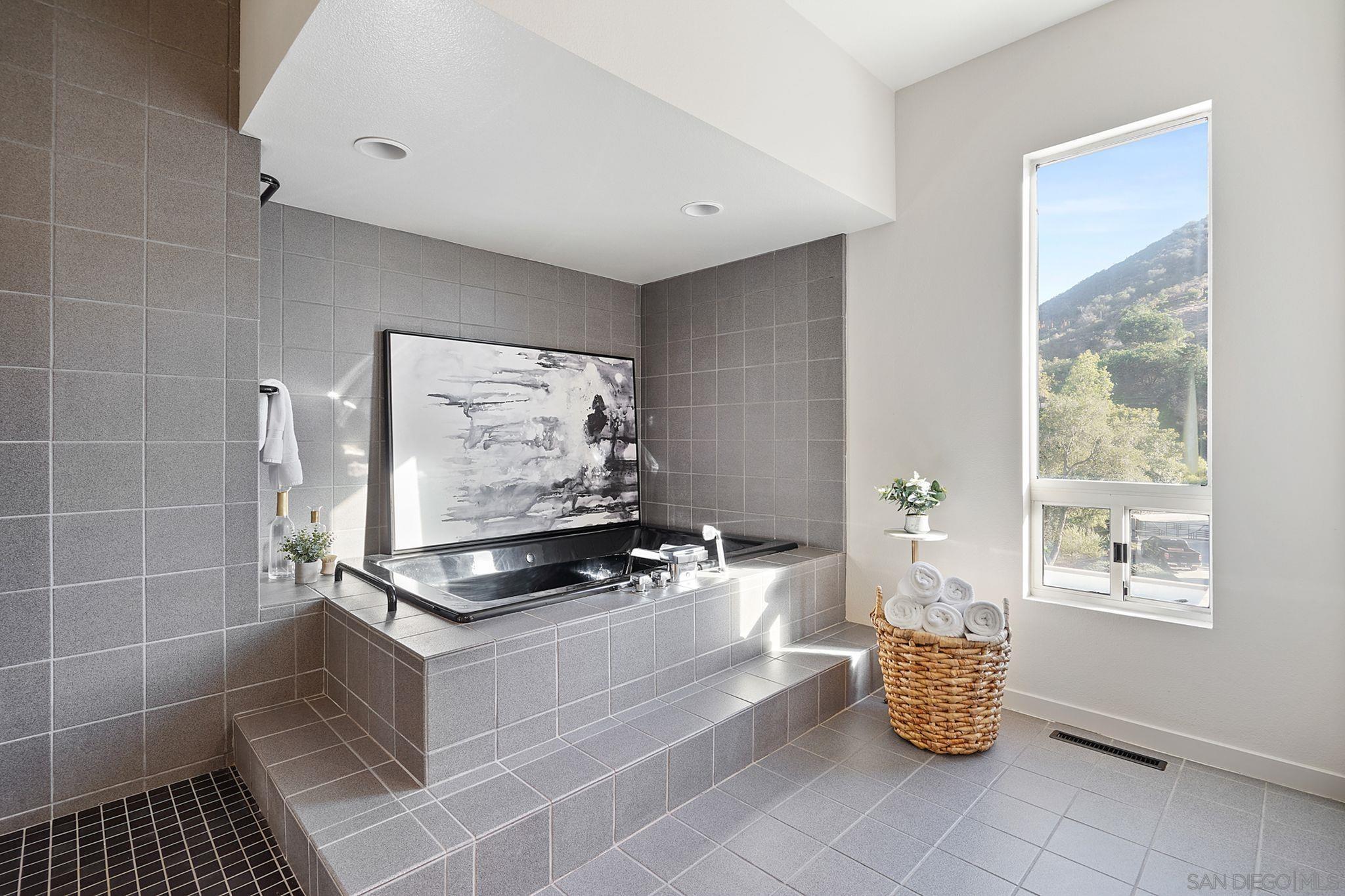 19969 Elfin Forest Lane Escondido, CA 92029 - Photo 28 of 53 a kitchen with granite countertop a stove and a window