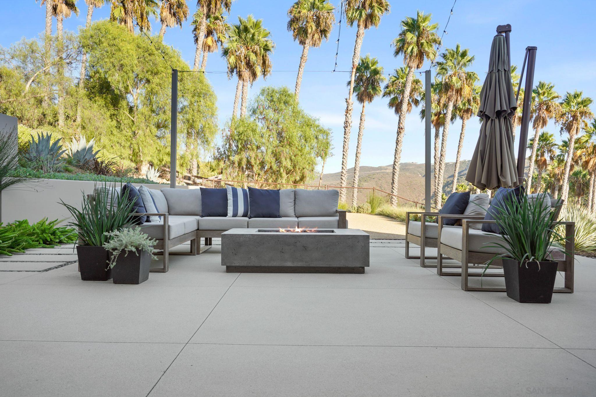 19969 Elfin Forest Lane Escondido, CA 92029 - Photo 33 of 53 a living room with furniture and a potted plant