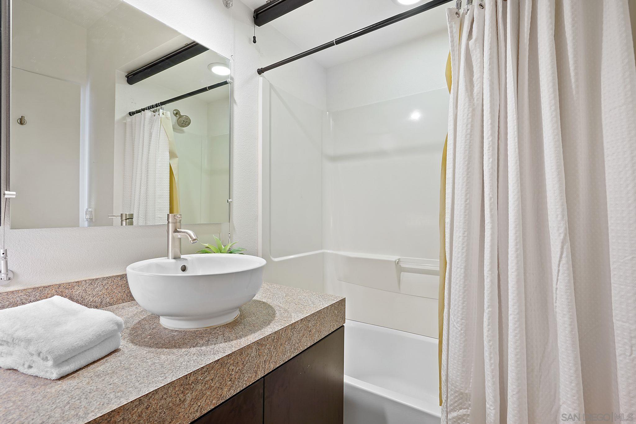 19969 Elfin Forest Lane Escondido, CA 92029 - Photo 43 of 53 a bathroom with a granite countertop sink and a mirror