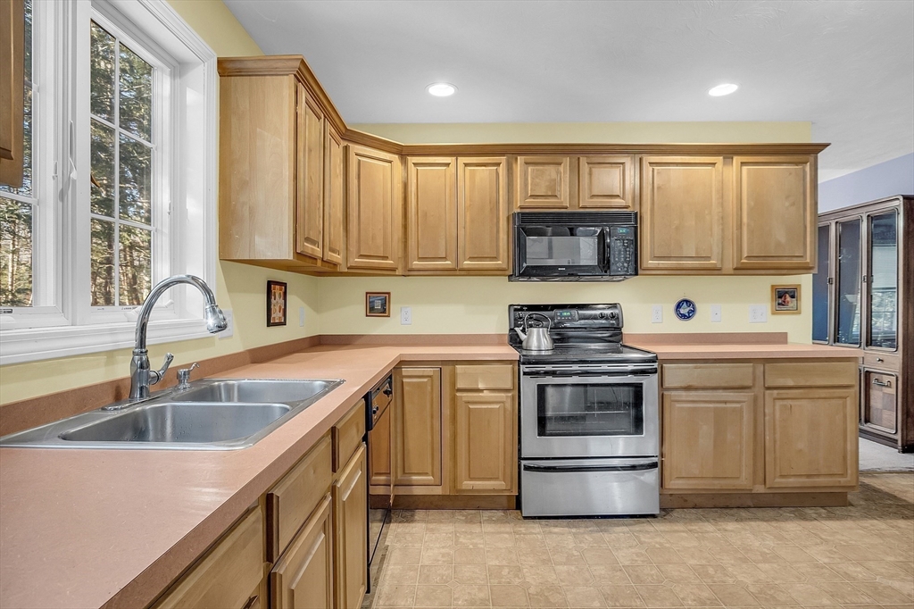 170 E Road, Unit 1 Orange, MA 01364 - Photo 14 of 22 a kitchen with a sink stove and cabinets
