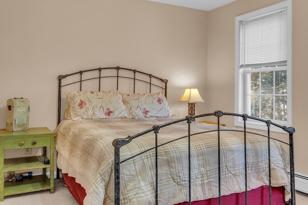 170 E Road, Unit 1 Orange, MA 01364 - Photo 17 of 22 a bedroom with a bed and a window