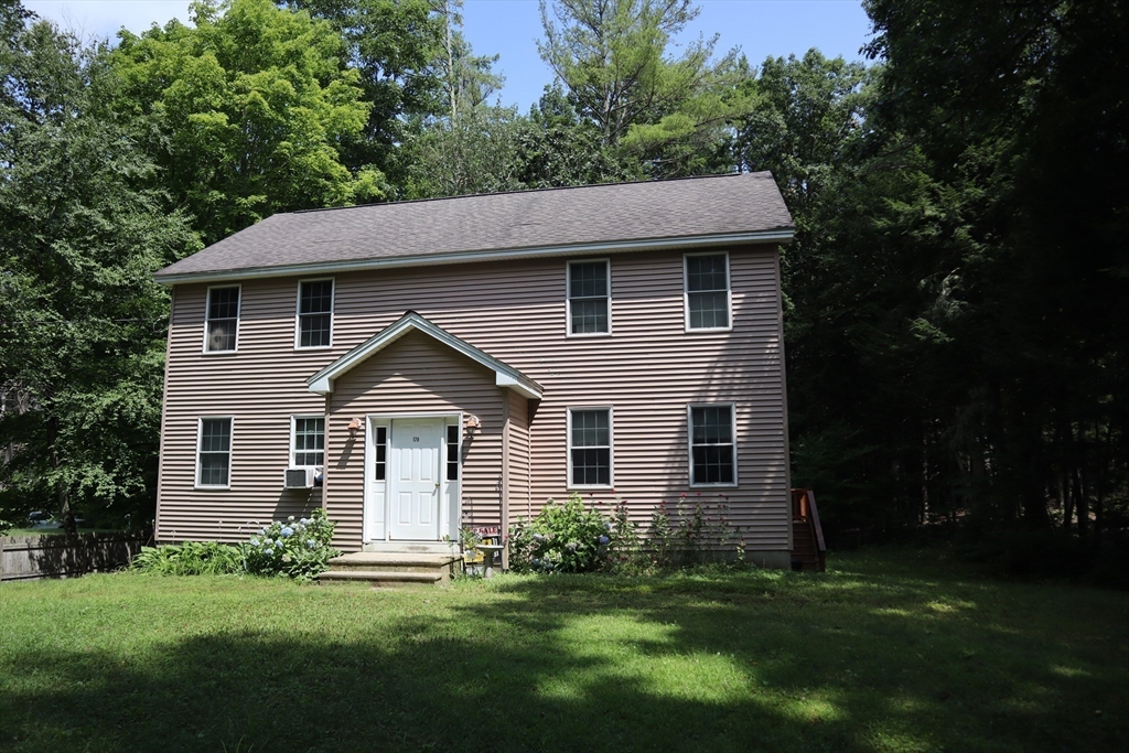 170 E Road, Unit 1 Orange, MA 01364 - Photo 2 of 22 a front view of a house with a garden