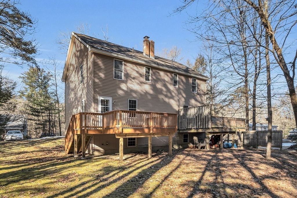 170 E Road, Unit 1 Orange, MA 01364 - Photo 3 of 22 a view of a house with large windows and a table and chairs