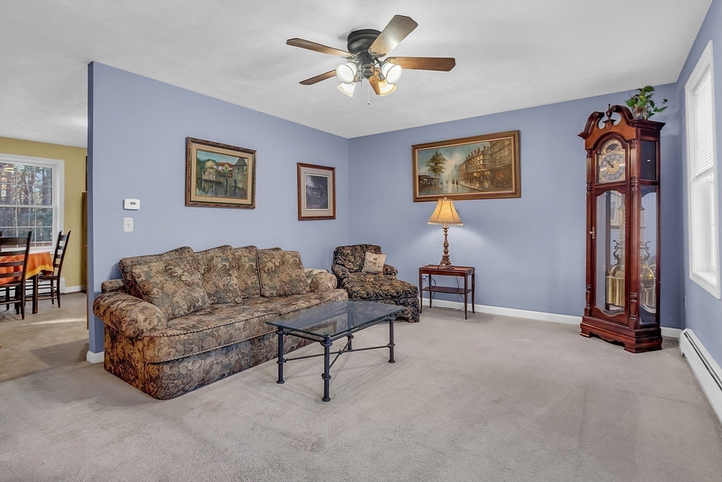 170 E Road, Unit 1 Orange, MA 01364 - Photo 8 of 22 a living room with furniture and a lamp