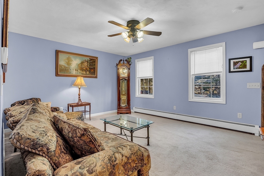 170 E Road, Unit 1 Orange, MA 01364 - Photo 9 of 22 a bedroom with furniture and a window