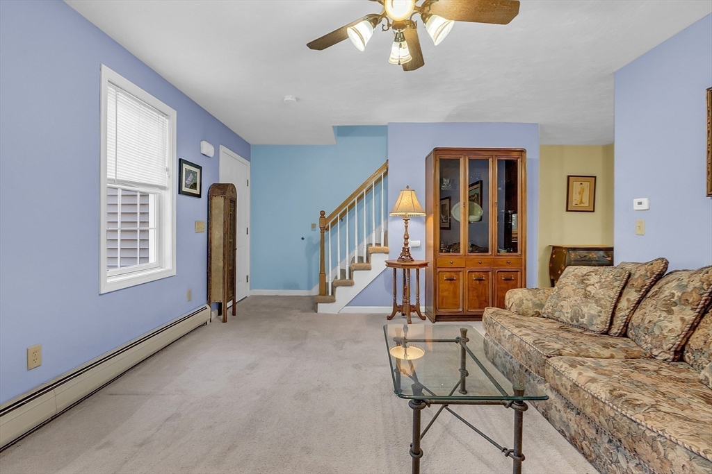 170 E Road, Unit 1 Orange, MA 01364 - Photo 10 of 22 a living room with furniture and a window