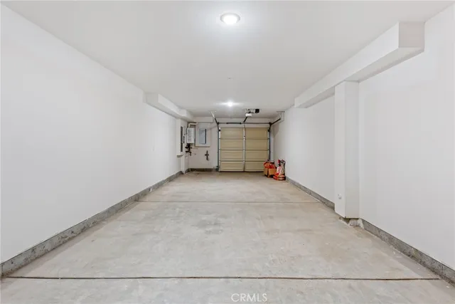 an empty room with a empty space and windows