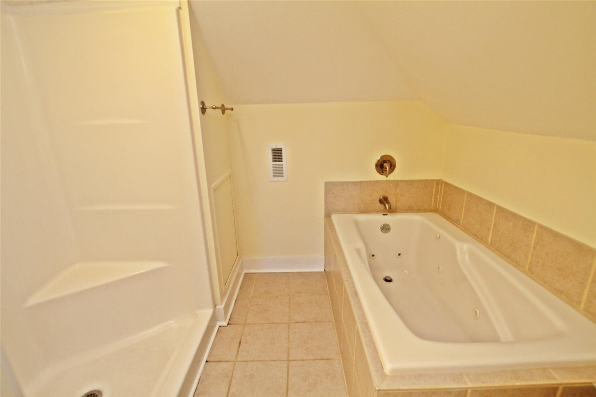 317 North Main Street Springfield, TN 37172 - Photo 16 of 30 a bathroom with a tub