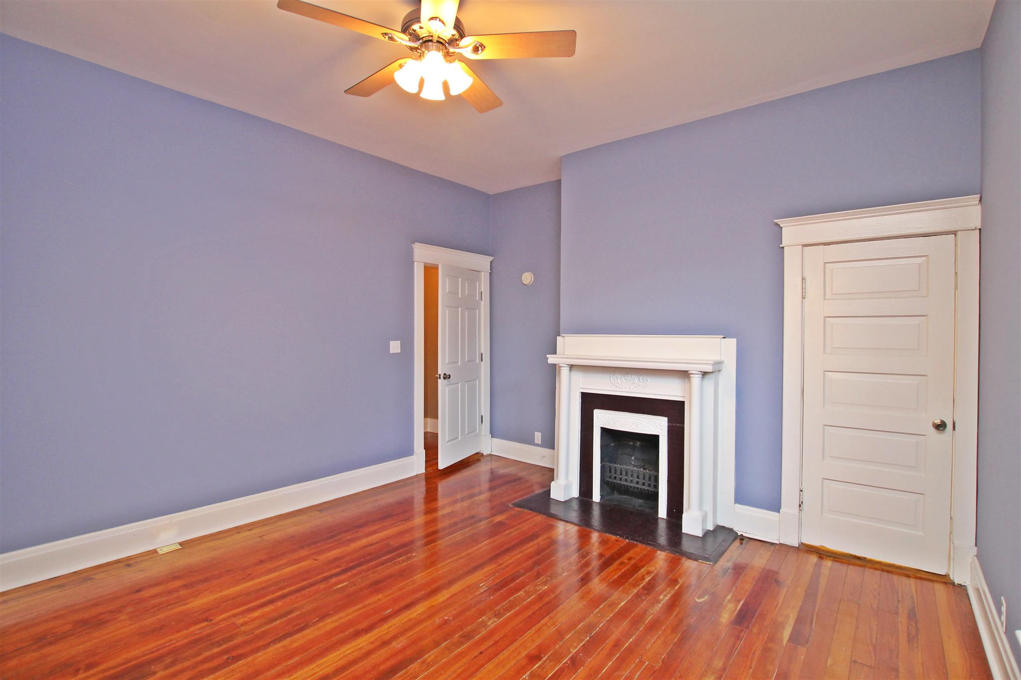 317 North Main Street Springfield, TN 37172 - Photo 19 of 30 wooden floor fireplace and windows in an empty room