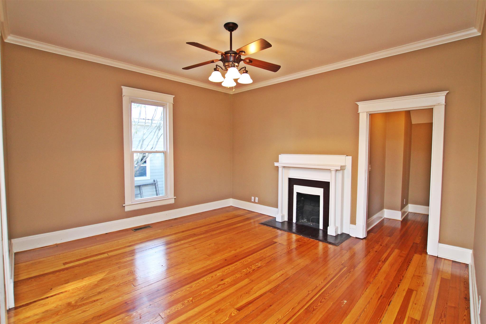 317 North Main Street Springfield, TN 37172 - Photo 3 of 30 a view of an empty room with window and wooden floor