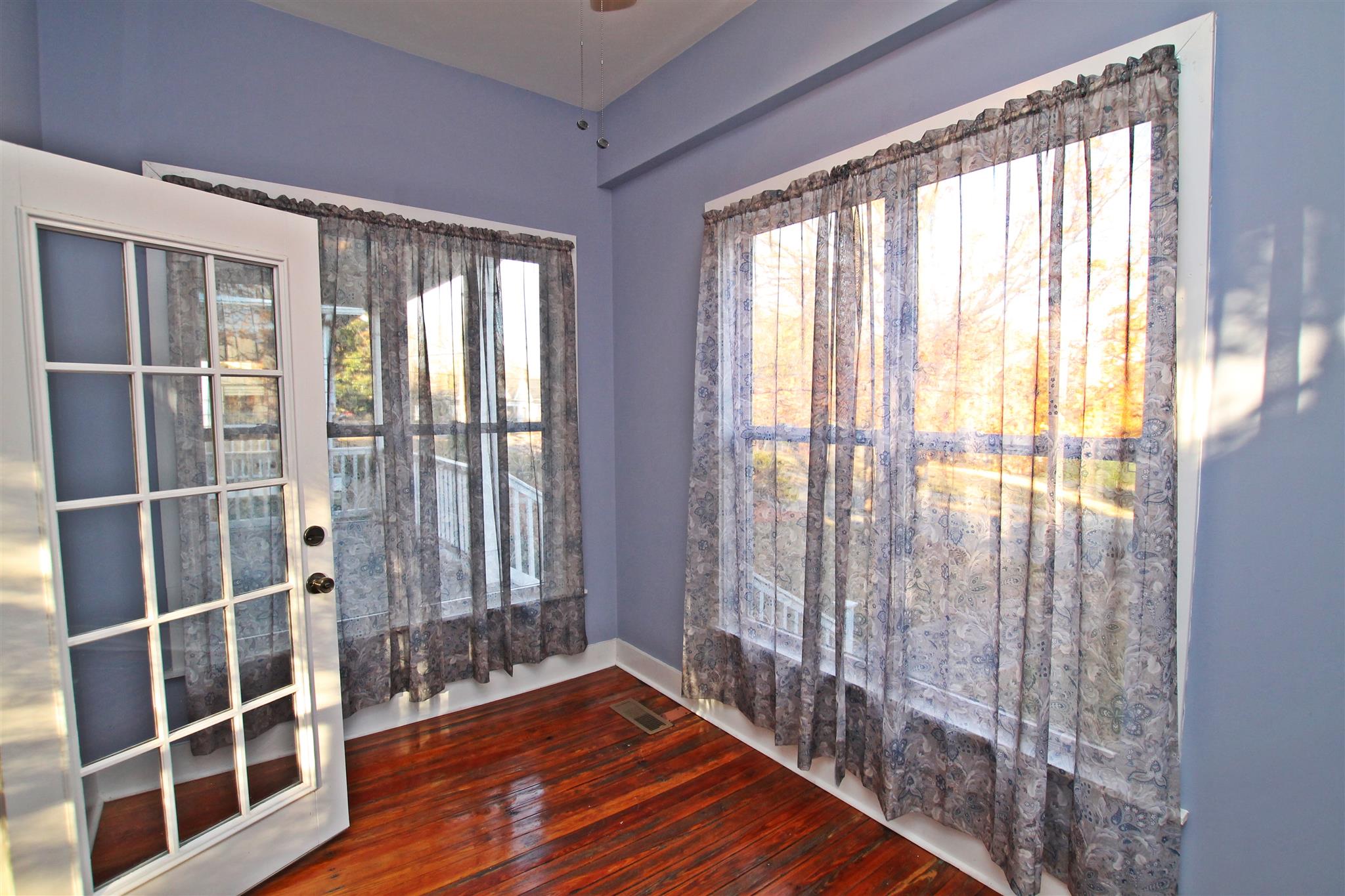 317 North Main Street Springfield, TN 37172 - Photo 23 of 30 a view of empty room with wooden floor and floor to ceiling window