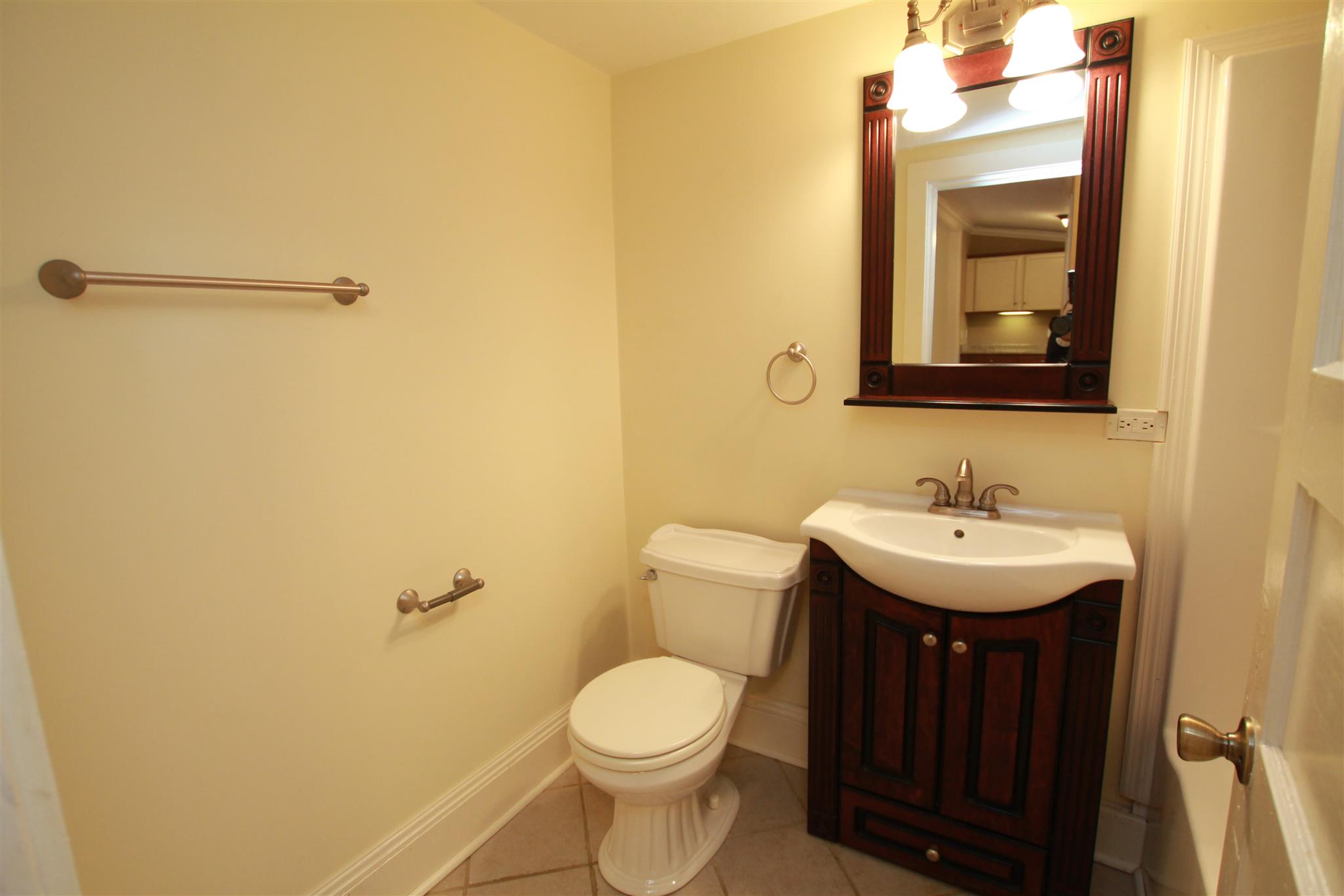 317 North Main Street Springfield, TN 37172 - Photo 25 of 30 a bathroom with a toilet sink and mirror
