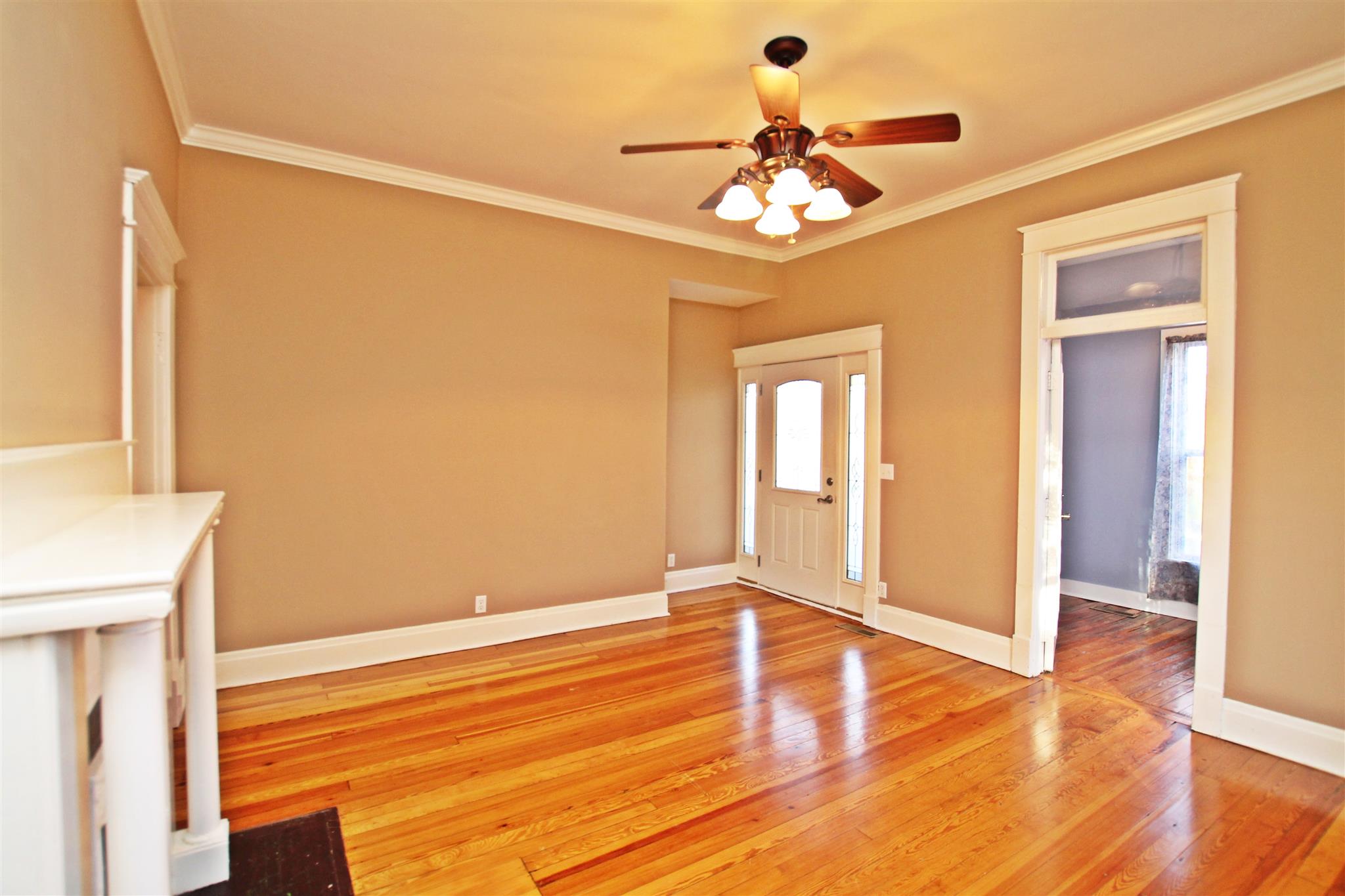 317 North Main Street Springfield, TN 37172 - Photo 5 of 30 a view of an empty room with wooden floor and a window