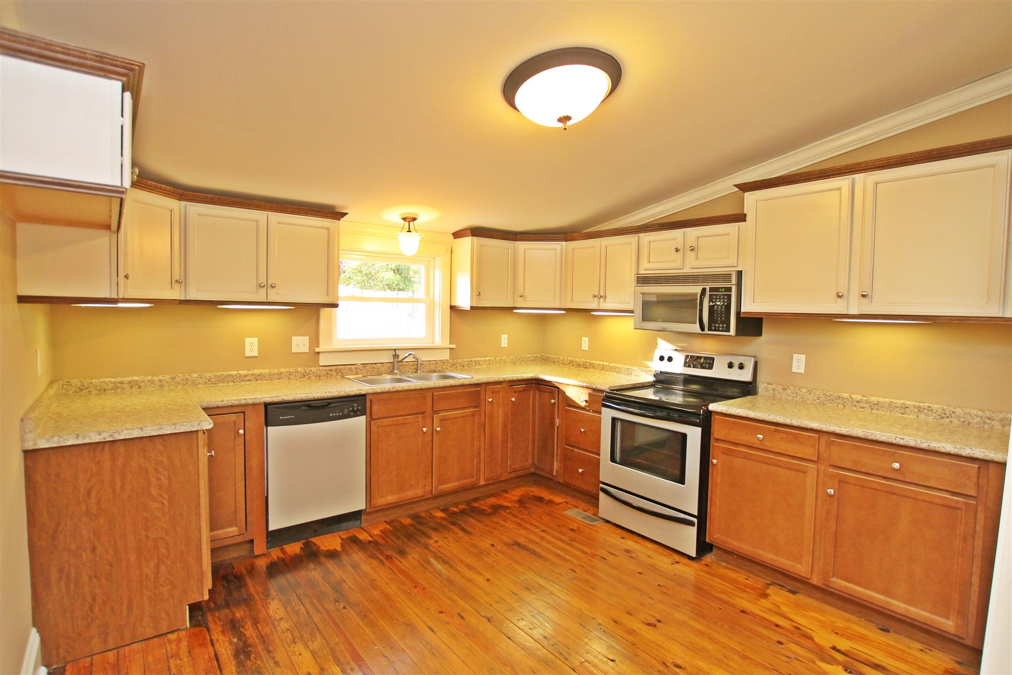 317 North Main Street Springfield, TN 37172 - Photo 7 of 30 a kitchen with stainless steel appliances granite countertop a sink and cabinets