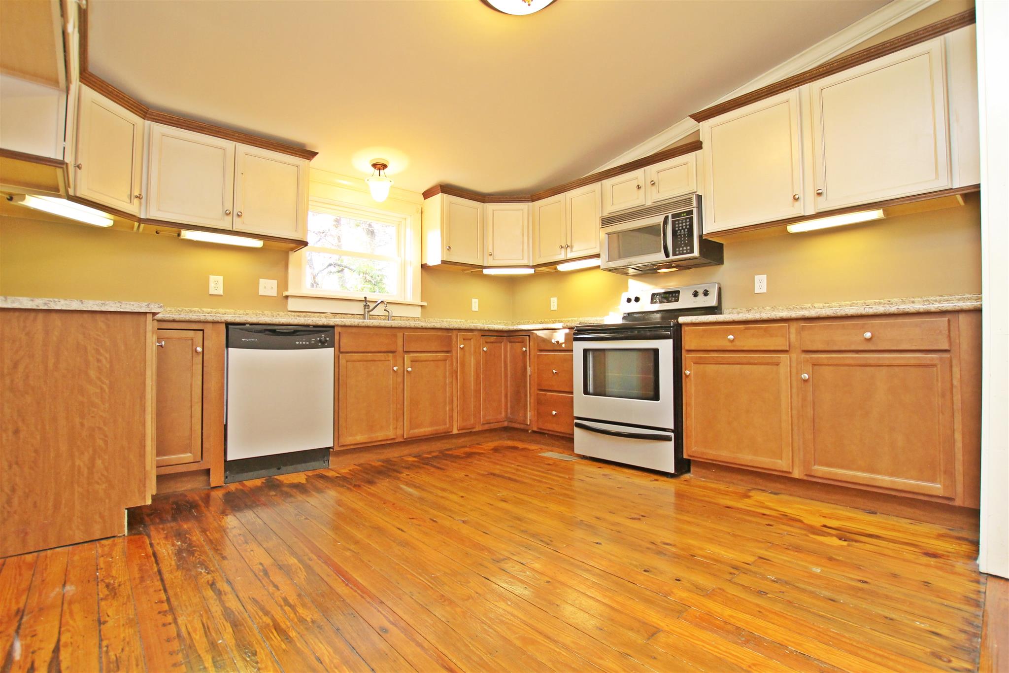 317 North Main Street Springfield, TN 37172 - Photo 8 of 30 a kitchen with stainless steel appliances granite countertop a stove a sink and white cabinets