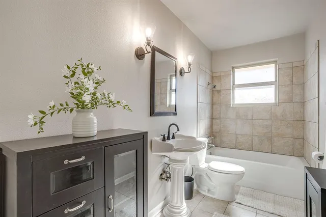 a bathroom with a sink a toilet and vanity