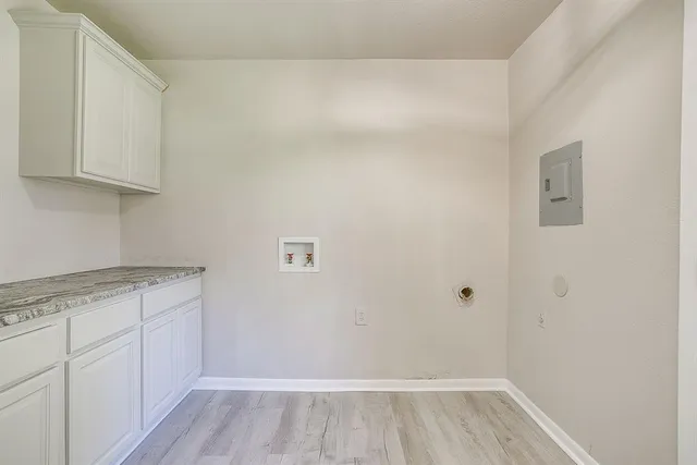 a view of cabinets with wooden floor