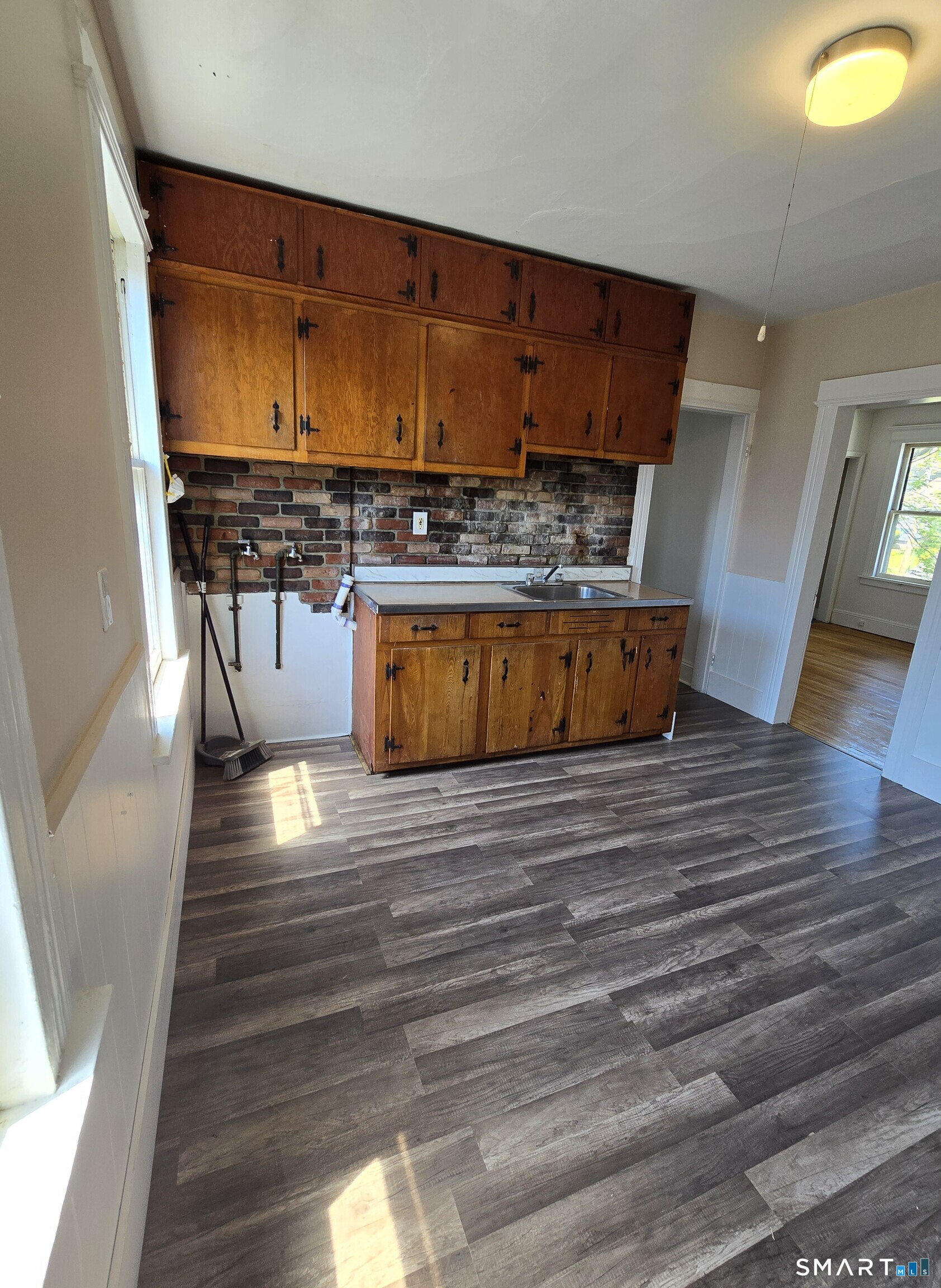 985 Huntington Road Stratford, CT 06614 - Photo 3 of 7 a view of kitchen and wooden floor