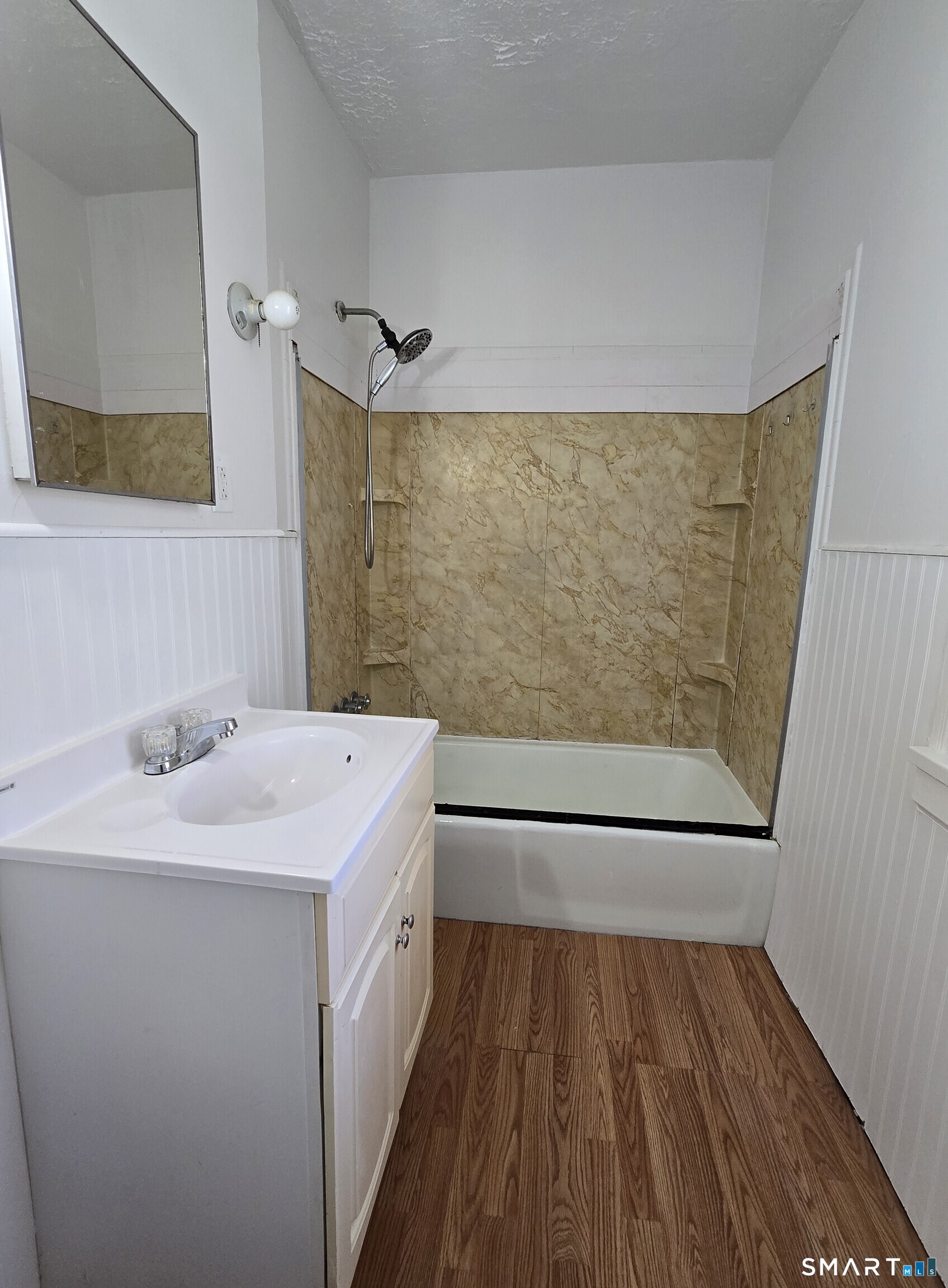 985 Huntington Road Stratford, CT 06614 - Photo 7 of 7 a bathroom with a sink and a mirror