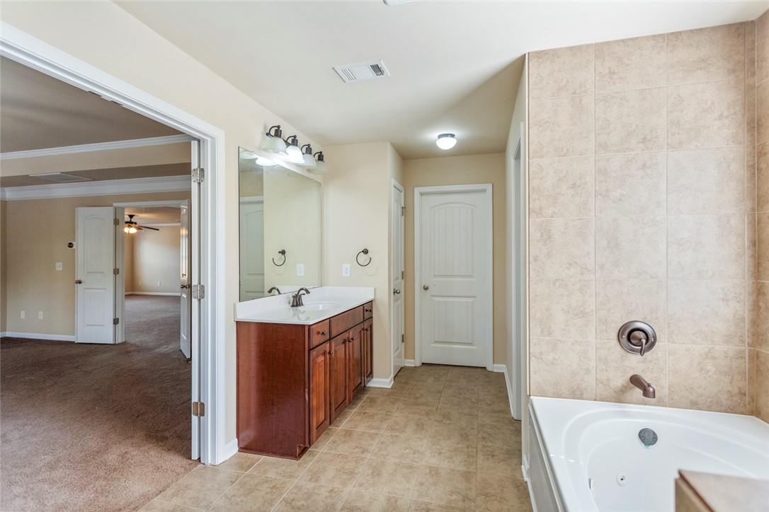 1005 Winmar Drive Anderson, SC 29621 - Photo 33 of 50 This bathroom features a deep soaking tub and an ample vanity for daily routines.