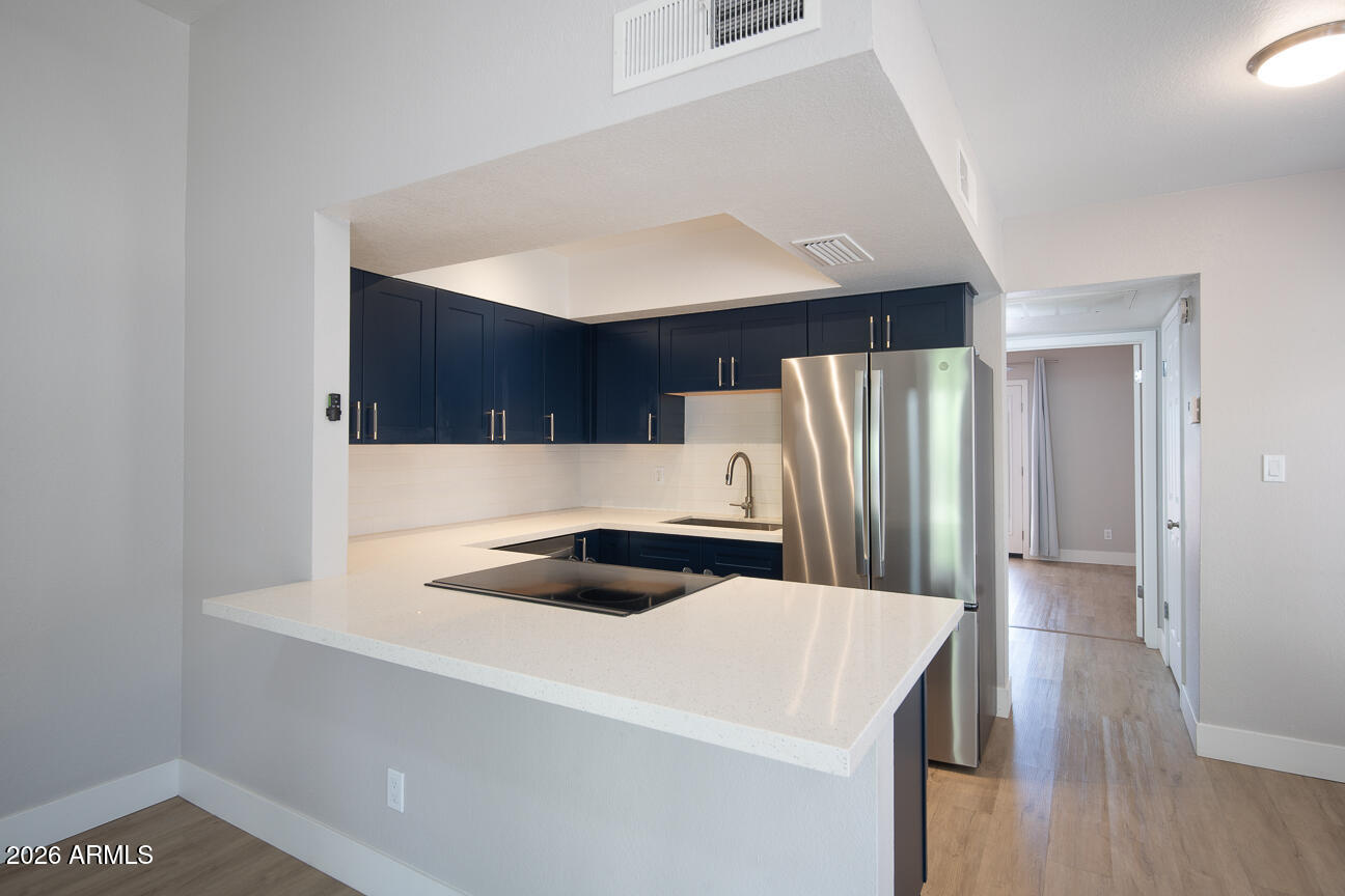 4540 North 44th Street, Unit 50 Phoenix, AZ 85018 - Photo 5 of 31 a kitchen with a refrigerator and a sink