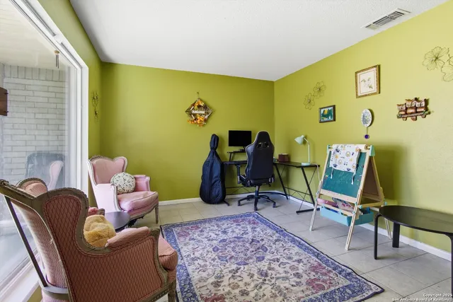 a living room with furniture and a rug