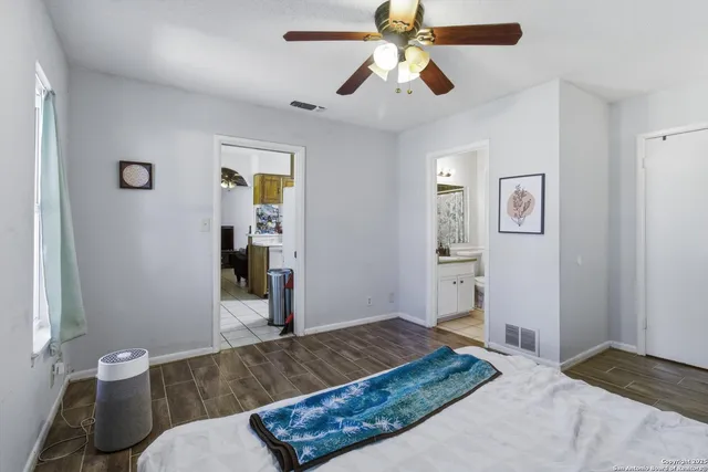 a bedroom with a bed and a dresser