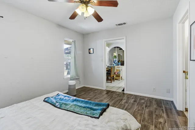 a bedroom with a bed and a dresser