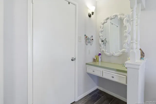 a bathroom with a sink a mirror and shower