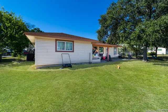 a backyard of a house with lots of green space