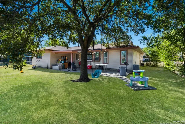 a house view with a sitting space and garden