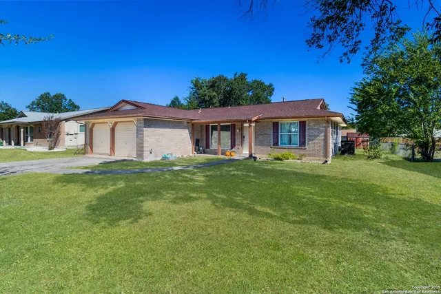 a view of a house with a yard porch and sitting area