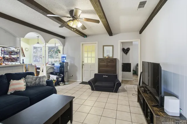 a living room with furniture and a large window