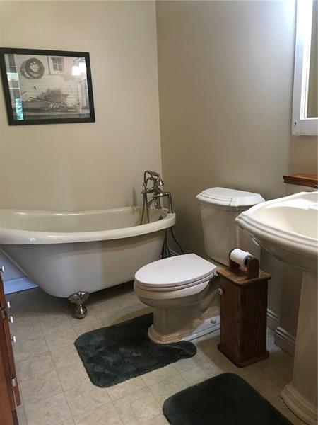 1133 Pine Run Road Apollo, PA 15613 - Photo 13 of 25 First floor bathroom has a claw foot soaking tub and pedestal sink. All gutted and restored 11 years ago.