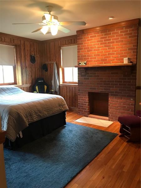 1133 Pine Run Road Apollo, PA 15613 - Photo 16 of 25 Second bedroom has a brick fireplace and oak floors and doors.