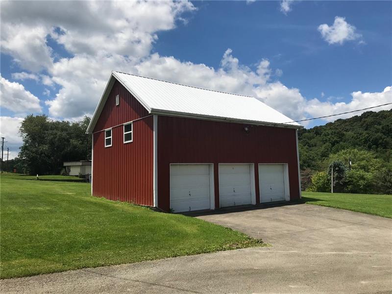 1133 Pine Run Road Apollo, PA 15613 - Photo 23 of 25 28x32 3 car garage with cement floor plus upstairs storage with a floor.