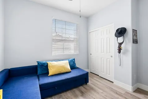 a living room with furniture and a window
