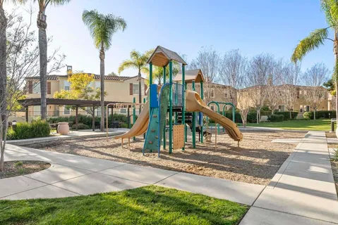 a view of a park with a slide
