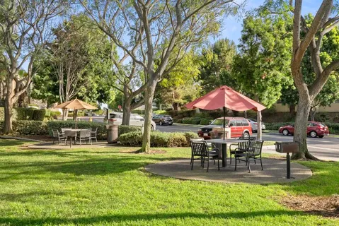 a view of playground with swimming pool