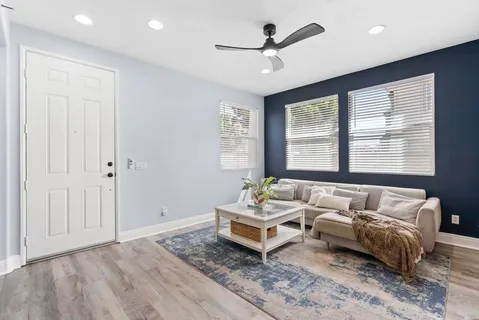 a living room with furniture and window