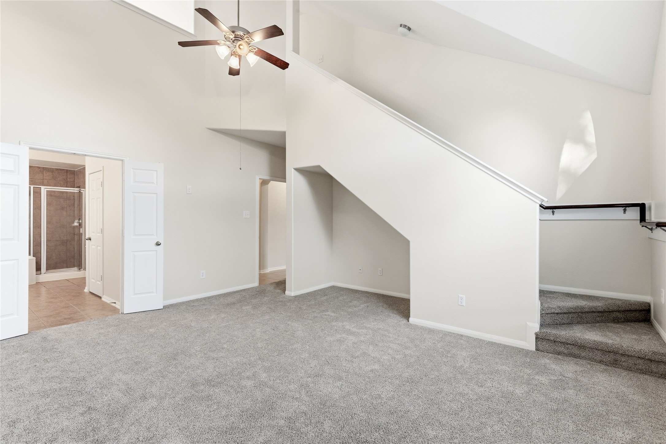 6211 Stone Hill Road Spring, TX 77389 - Photo 19 of 43 a view of an empty room with a ceiling fan
